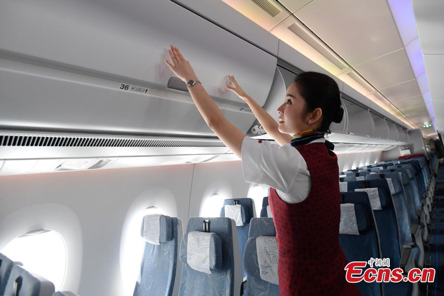 A stewardess makes security check in Air China’s first A350-900 aircraft before it flies on the Beijing-Chengdu route, Aug. 15, 2018. Air China has configured the widebody aircraft with three classes, offering a total of 312 seats. The business class cabin has 32 seats laid out in a 1-2-1 reverse herringbone pattern. The premium economy cabin has 24 seats and the economy cabin offers 256 seats. (Photo: China News Service/An Yuan)