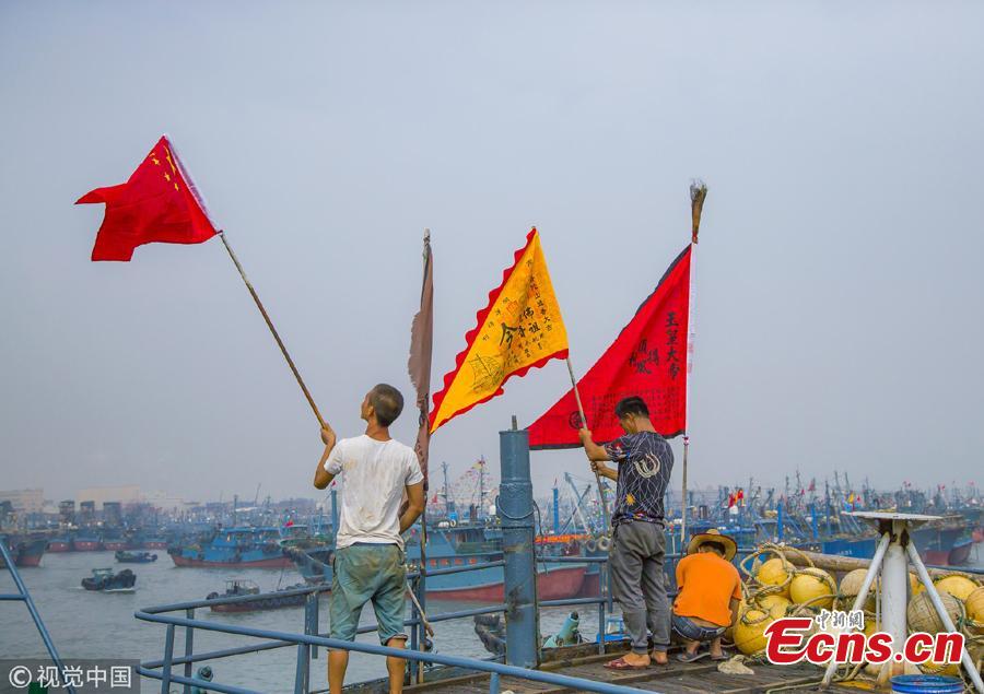 A ceremony to mark the end of a fishing ban, imposed to help increase fish stocks, at a port in Shishi City, Fujian Province, Aug. 16, 2018. Shishi boasts a large national fishing port, and a majority of the city’s ships go fishing near the Diaoyu Islands. (Photo/VCG)