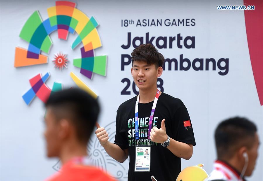 Chinese badminton athlete Liu Yuchen poses for pictures at the Asian Games Village ahead of the 18th Asian Games in Jakarta, Indonesia, on Aug. 17, 2018. August 18 will witness the opening ceremony of the 18th Asian Games in Jakarta, Indonesia. (Xinhua/Huang Zongzhi)