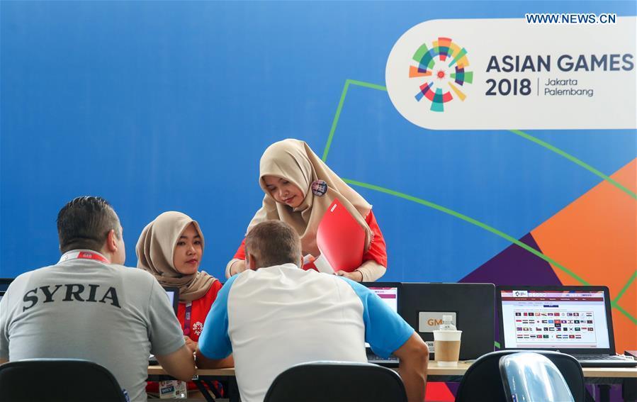 Volunteers provide service for athletes at the Asian Games Village ahead of the 18th Asian Games in Jakarta, Indonesia, on Aug. 17, 2018. August 18 will witness the opening ceremony of the 18th Asian Games in Jakarta, Indonesia. (Xinhua/Ding Ting)