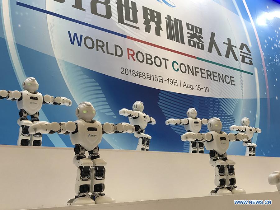 Robots are dancing at the 2018 World Robot Conference in Beijing, Aug. 17, 2018. The conference attracts a total of 166 domestic and international enterprises exhibiting their cutting edge technologies and more than 500 items are displayed at the scene. (Xinhuanet/Liang Yurou)