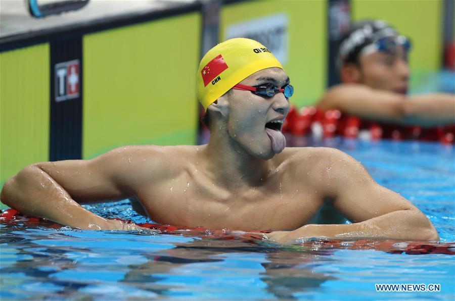 Xu Jiayu of China celebrates after winning the gold medal of men\'s 100m backstroke final in the 18th Asian Games in Jakarta, Indonesia, Aug. 19, 2018. (Photo/Xinhua)
Xu Jiayu of China wins gold medal of men\'s 100m backstroke final at 18th Asian Games Sunday.