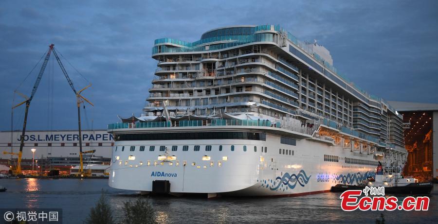 The \'AIDAnova\' cruise ship is towed away from the Meyer Werft shipyards on August 21, 2018 in Papenburg, Germany. The newly-completed 184,000-tonne ship, which is 337 meters long and can accommodate 6,600 passengers, cast and crew. AIDAnova is the World\'s first liquefied natural gas (LNG)-Powered Cruise Ship. (Photo/Agencies)