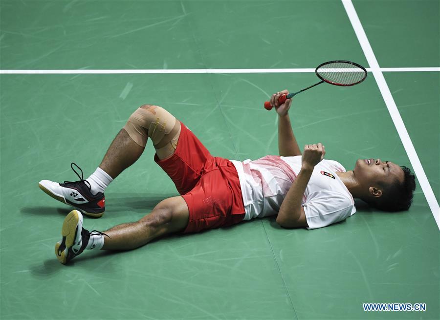 Indonesia\'s Anthony Sinisuka reacts during the singles match of men\'s team final between China and Indonesia at the 18th Asian Games in Jakarta, Indonesia on Aug. 22, 2018. (Xinhua/Du Yu)