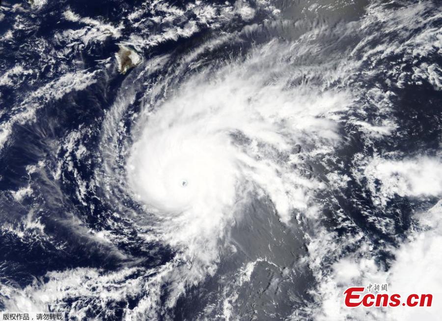 This NASA satellite natural-color image made at 10:45 a.m. Hawaii Standard Time (20:45 GMT) on Tuesday, Aug. 21, 2018, shows Hurricane Lane as a powerful category 4 storm with maximum sustained winds of 250 kilometers (155 miles) per hour. The Big Island of Hawaii is at upper left. (Photo/Agencies)