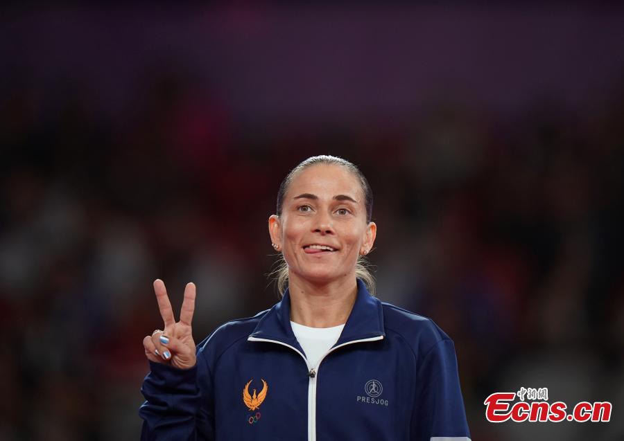 Uzbekistan’s Oksana Chusovitina celebrates after winning a silver medal in vault at the Asian Games in Jakarta, Indonesia, Aug.23, 2018. (Photo: China News Service/Hou Yu)