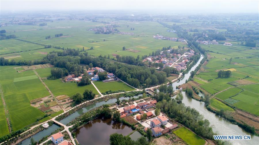 Aerial photo taken on Aug. 22, 2018 shows a section of Changqu Canal in Xiangyang, central China\'s Hubei Province. The Changqu Canal has been added to the World Heritage Irrigation Structures list by the International Commission on Irrigation and Drainage (ICID) recently. (Xinhua/Xiong Qi)
