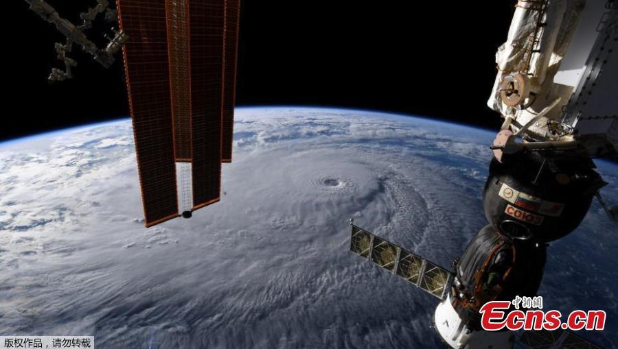 A handout image made available by NASA and taken by an Expedition 56 crew member from the International Space Station shows Hurricane Lane in the Central Pacific Ocean, near Hawaii, Aug. 22, 2018. Hurricane Lane weakened to a Category 3 storm on Thursday but was already lashing Hawaii with high winds and torrential rains, touching off flash floods, landslides and raging surf as residents hunkered down to ride out the storm. (Photo/Agencies)