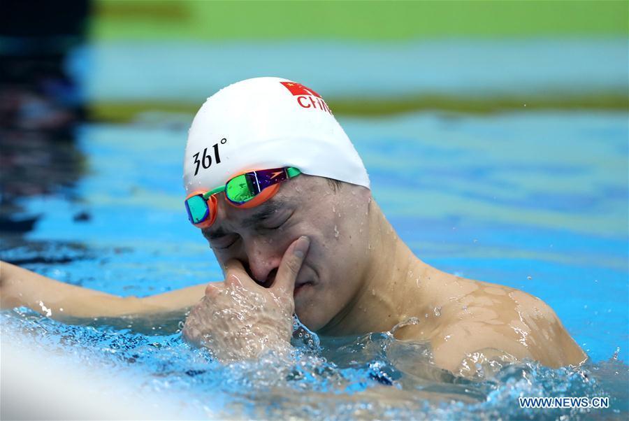 Sun Yang of China reacts after men\'s 1500m freestyle final of swimming at the 18th Asian Games in Jakarta, Indonesia, Aug. 24, 2018. Sun won the gold medal. (Xinhua/Fei Maohua)