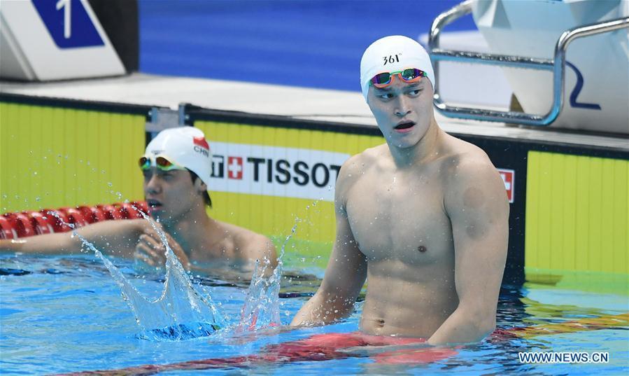 Sun Yang (R) of China celebrates after men\'s 1500m freestyle final of swimming at the 18th Asian Games in Jakarta, Indonesia, Aug. 24, 2018. Sun won the gold medal. (Xinhua/Yue Yuewei)