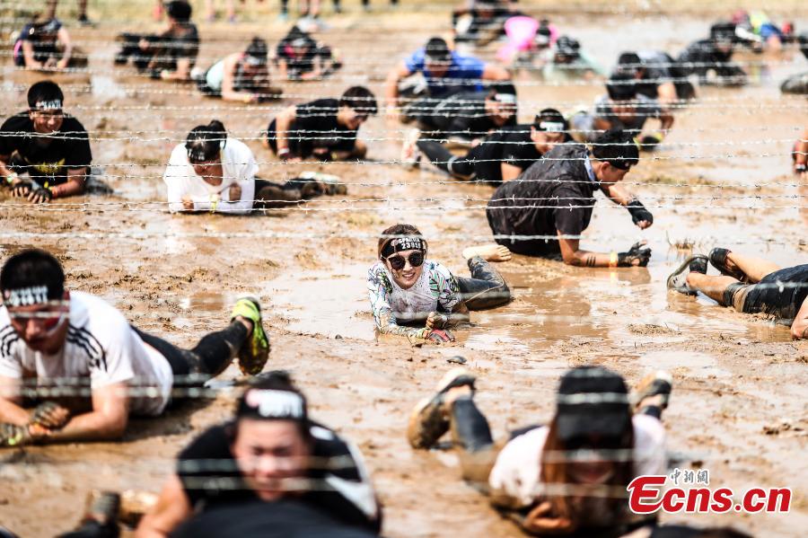 Participants compete in the 2018 Beijing Spartan Trifecta Weekend in Beijing, Aug. 26, 2018. More than 15,000 contestants participated in the obstacle course race that included three events of differing difficulty levels. (Photo: China News Service/Fu Tian)