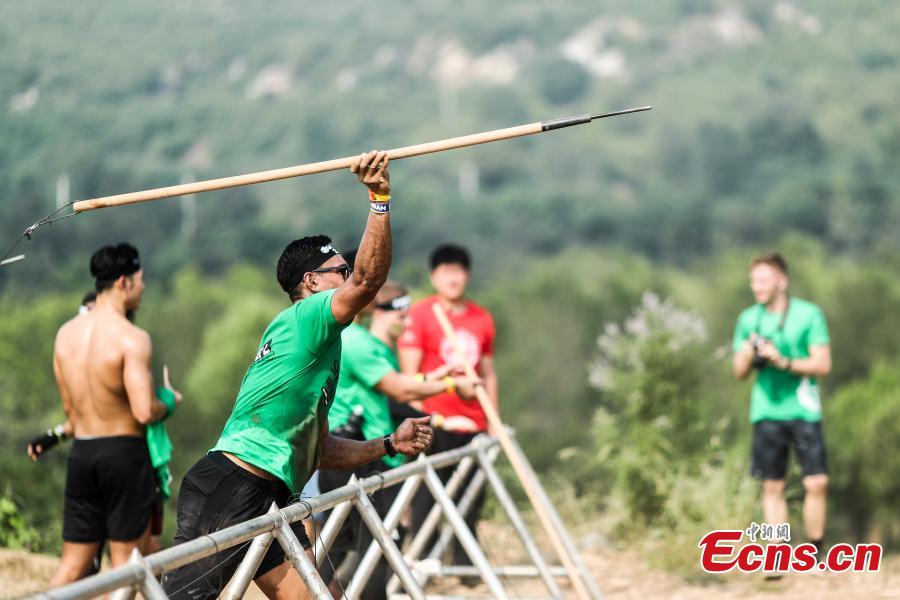 Participants compete in the 2018 Beijing Spartan Trifecta Weekend in Beijing, Aug. 26, 2018. More than 15,000 contestants participated in the obstacle course race that included three events of differing difficulty levels. (Photo: China News Service/Fu Tian)