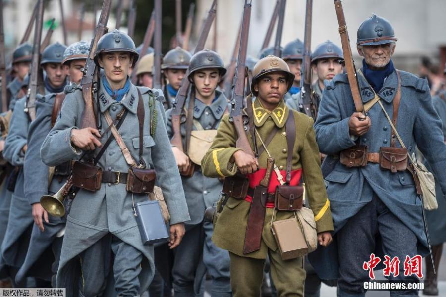 Men dressed in WWI uniforms march during a parade, part of the reconstruction of the WWI battle of Verdun, Aug. 25, 2018, in Verdun, eastern France. Hundreds of volunteers from 18 countries gathered in the French town Verdun as part of a string of events to mark the centenary of the end of World War One, with re-enactors dressed in period soldiers’ uniforms bringing to life a big military encampment in the town. (Photo/Agencies)