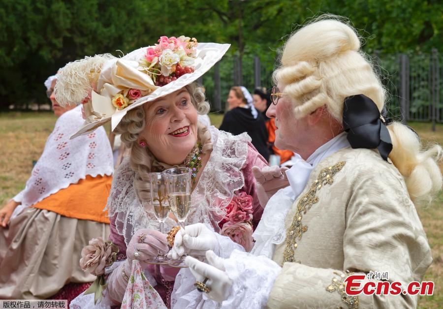 People dressed in costume takes part in the picnic near the Friedenstein Castle, during the Baroque Festival in Gotha, Germany, Aug. 25, 2018. For the past fifteen years the city of Gotha transforms into an 18th Century city for the annual festival. (Photo/Agencies)