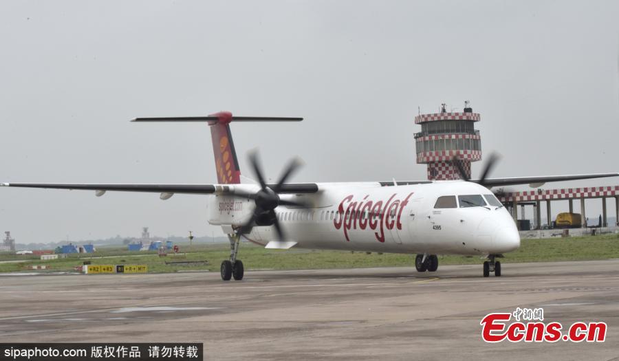 India\'s first biojet fuel aircraft, operated by SpiceJet, lands at Indira Gandhi International Airport in New Delhi, India, Aug. 27, 2018. The SpiceJet aircraft from Dehradun to Delhi had aviation regulator DGCA (Directorate General of Civil Aviation) officials along with other industry stakeholders on board, to ascertain the feasibility of biofuel-powered flights. (Photo/SipaPhoto)