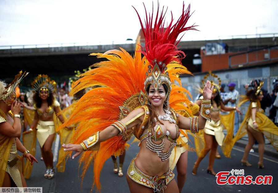 Revelers take part in the Notting Hill Carnival in London, Britain August 27, 2018. The Notting Hill Carnival is a symbol of interracial tolerance which dates back to the 1960s and celebrates the Afro-Caribbean community. (Photo/Agencies)