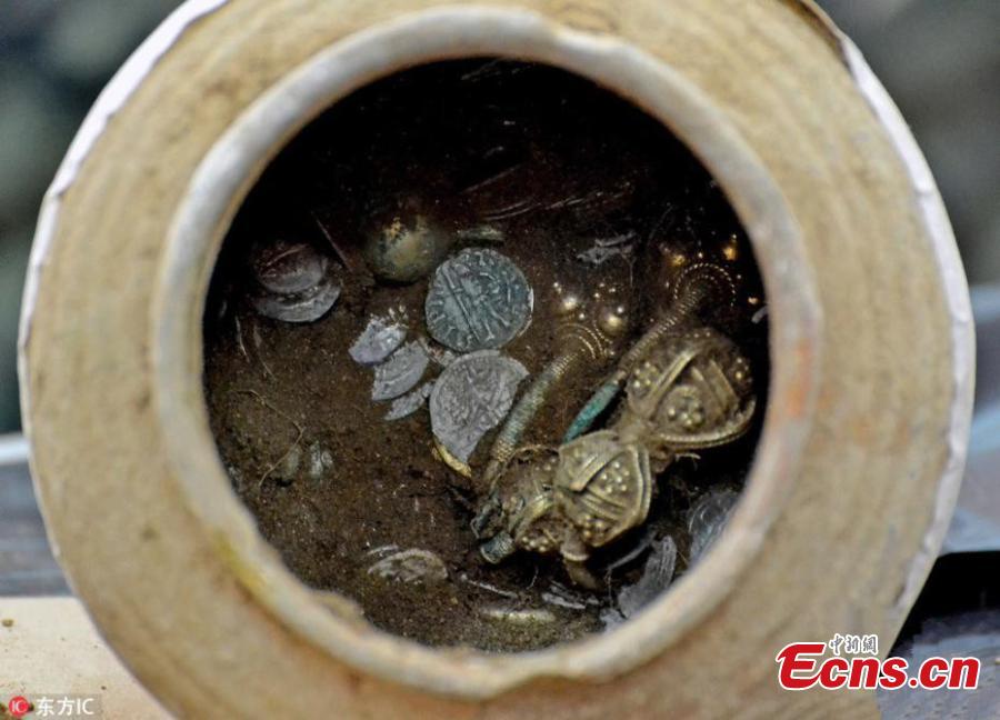 Photo released by the National History Museum in Bulgaria shows god and silver findings excavated in Kaliakra Fortress by archeologists on Aug. 15, 2018. The clay treasure pot contained 873 silver and 28 gold artifacts believed to have been looted by a Tatar (Mongol) leader in the 14th century. (Photo/IC)