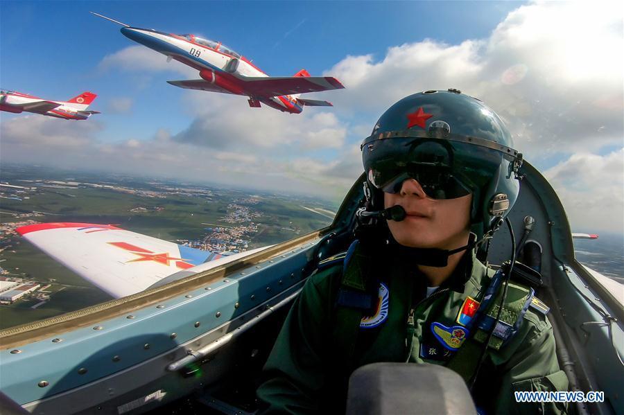 A pilot of Red Falcon Air Demonstration Team performs during an activity of opening day at the Aviation University of Air Forces in Changchun, capital of northeast China\'s Jilin Province, Aug. 30, 2018. (Xinhua/Yang Pan)