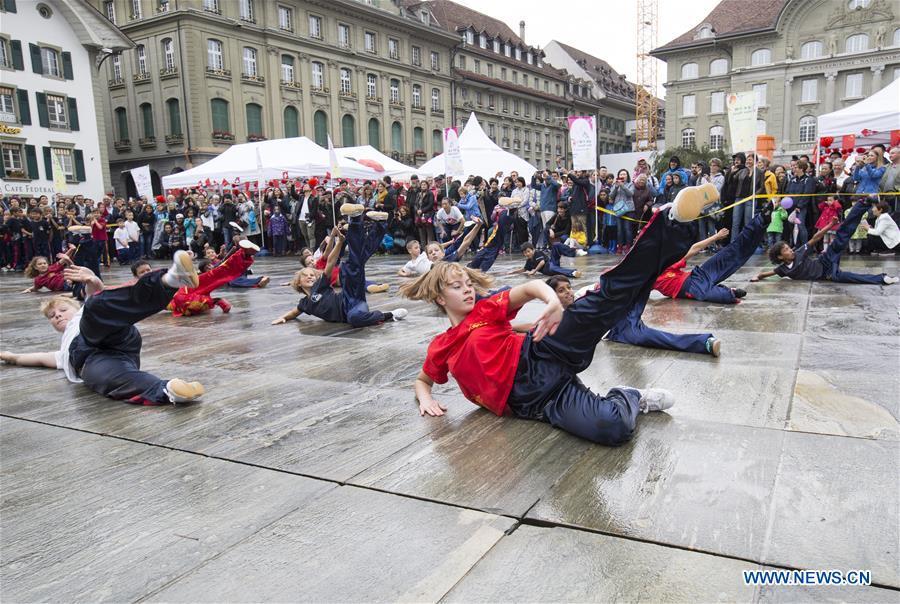 Local teenagers perform Chinese martial arts during the \