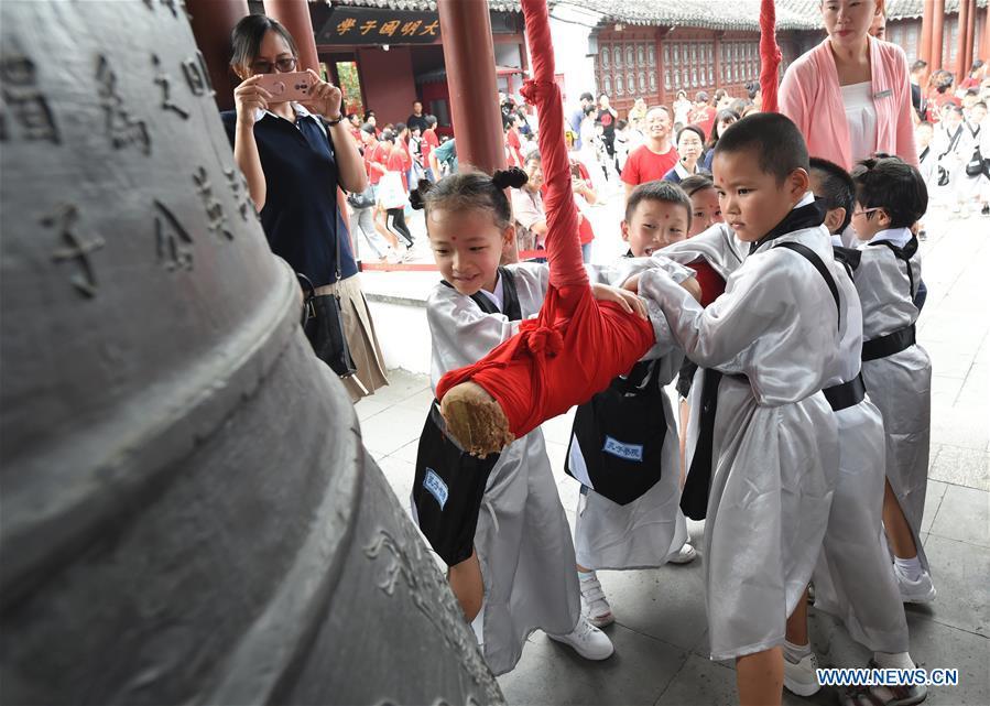 Children attend a first writing ceremony, a traditional education activity for first year students in China, in Nanjing, capital of east China\'s Jiangsu Province, Sept. 2, 2018. (Xinhua/Sun Can)