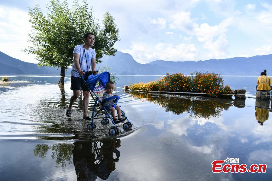 Water overflows the shores of Lugu Lake, a tourist attraction in Ninglang Yi Autonomous County, Southwest China’s Yunnan Province, Sept. 2, 2018. Local authorities have increased efforts to release more water from the lake following days of heavy rain. (Photo: China News Service/Ren Dong)