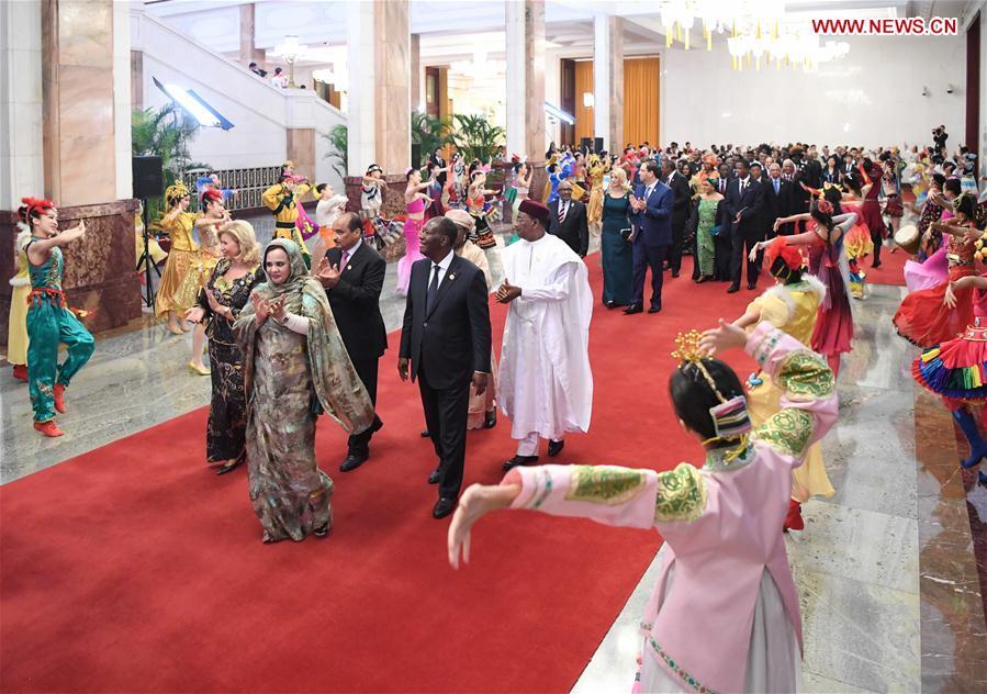 Foreign leaders and their spouses attending the Beijing Summit of the Forum on China-Africa Cooperation (FOCAC) are greeted by young performers on their way to a welcoming banquet held by Chinese President Xi Jinping and his wife Peng Liyuan at the Great Hall of the People in Beijing, capital of China, Sept. 3, 2018. (Xinhua/Shen Hong)
