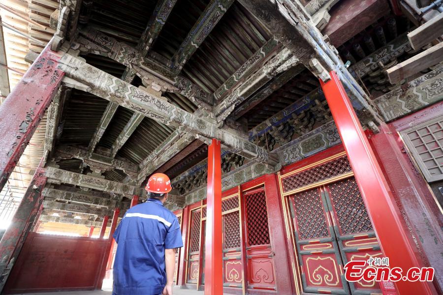 After preparing for two years, the research project into the restoration and conservation of The Hall of Mental Cultivation was launched on September 3, 2018 at the Palace Museum. Preparations began in December 2015, when collections inside the hall were labeled, recorded, restored and studied. The restoration work will cover 7,707 square meters, including 13 ancient buildings along with the doors and screen wall. (Photo: China News Service/Zhang Yu)