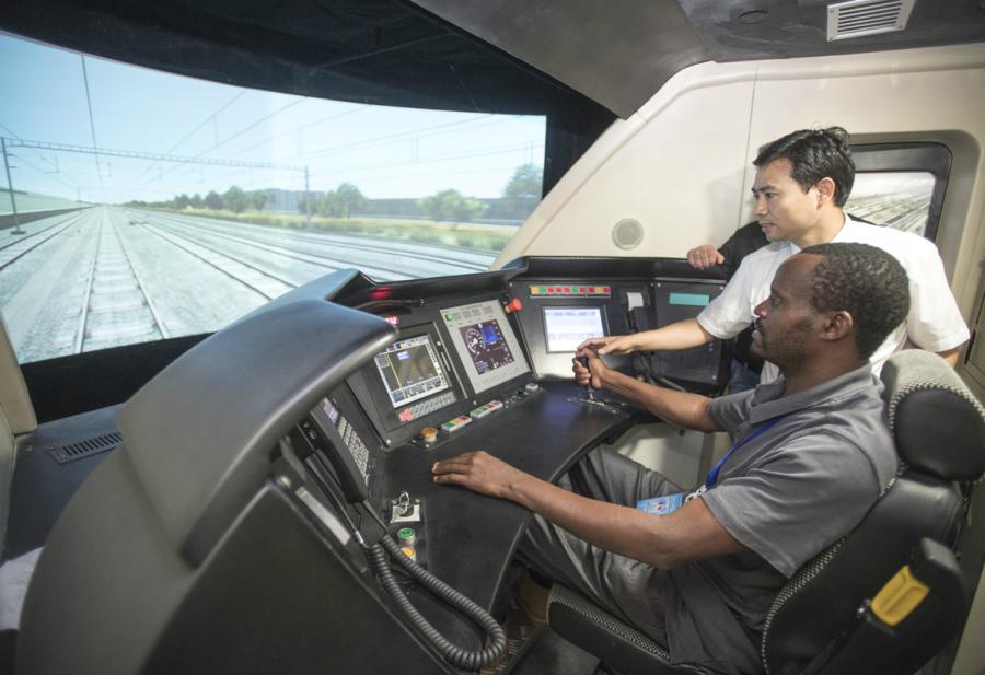 A Kenyan railway executive gets on the fast track in a state-of-the-art train simulator in Wuhan, Hubei Province, in June. (Photo/Xinhua)