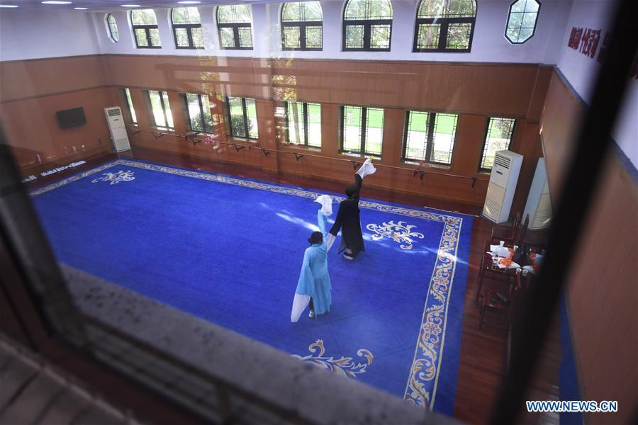 Wang Hongyuan (R) practices performing long sleeves skill at Shengzhou Yue Opera art school in Shengzhou, east China\'s Zhejiang Province, Sept. 3, 2018. Wang Hongyuan, 17, was born in Taizhou of Zhejiang Province. He is the only male student who learns playing Xiaosheng (role of young man) in Yue Opera at Shengzhou Yue Opera art school. Xiaosheng are usually played by female actresses in Yue Opera which is an old art form originated in Shengzhou and noted for its lyricism and sweet tunes in China. Wang Hongyuan was granted special admission on account of his talent and resolve when he was at second grade in junior middle school. After hard practices, he has already taken part in some performances. (Xinhua/Weng Xinyang)