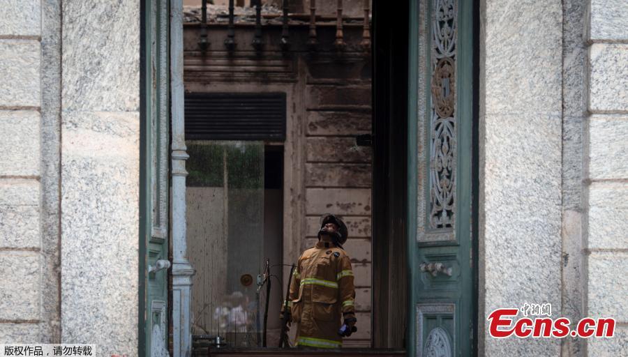 A firefighter inspects the burnt National Museum in Rio de Janeiro, Brazil, on September 4, 2018 two days after a massive fire ripped through the building.
Brazilian officials on Monday blamed years of government cutbacks for an inferno that gutted the treasured National Museum, described by President Michel Temer as a \