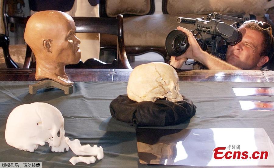 File photo taken on September 20, 1999 of a cameraman recording the presentation of the reconstruction of the head of \