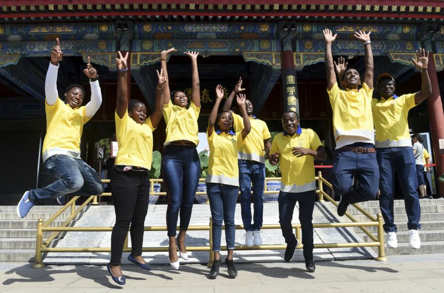 African students, who work as volunteers at Yuanmingyuan, or the Old Summer Palace, jump in unison for a group photo in Beijing on Friday. Yuanmingyuan set up a volunteer recruitment team last year. (Photo/Xinhua)
As commercial ties with Africa undergo a transformation, links between various sectors are flourishing and increasing numbers of talented and educated Africans are coming to China to master the skills required to ensure success.