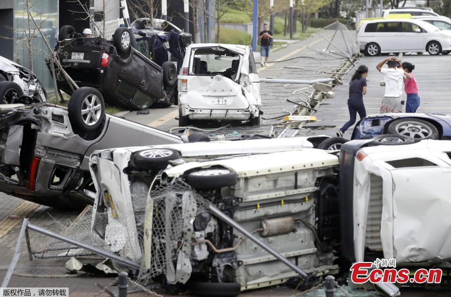 Vehicles damaged by Typhoon Jebi are seen in Osaka, western Japan,?in this photo taken by Kyodo September 4, 2018.(Photo/Agencies)