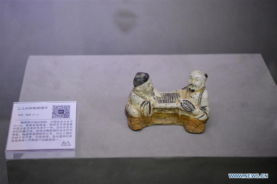 An exhibit depicting people playing Go is displayed at Go (Weiqi) museum in Luoyang, central China\'s Henan Province, Sept. 5, 2018. The private museum displays about 25,000 exhibits relating to Go game in China. (Xinhua/Feng Dapeng)
