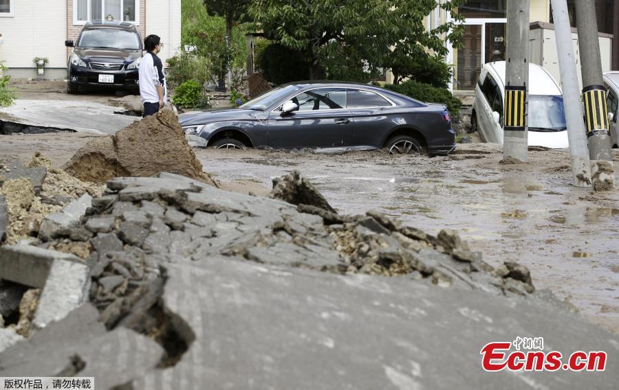 A man is seen at an area damaged by an earthquake in Sapporo in Japan\'s northern island of Hokkaido, Japan, in this photo taken by Kyodo September 6, 2018.