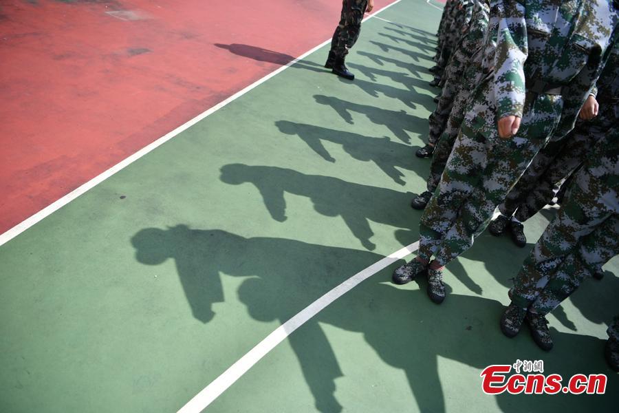 Freshman students from the Yunnan Arts University pose for photos during a compulsory military training in Kunming City, Southwest China’s Yunnan Province, Sept. 6, 2018. Military training, compulsory for freshmen in China\'s colleges, includes a diverse range of programs. (Photo: China News Service/Liu Ranyang)