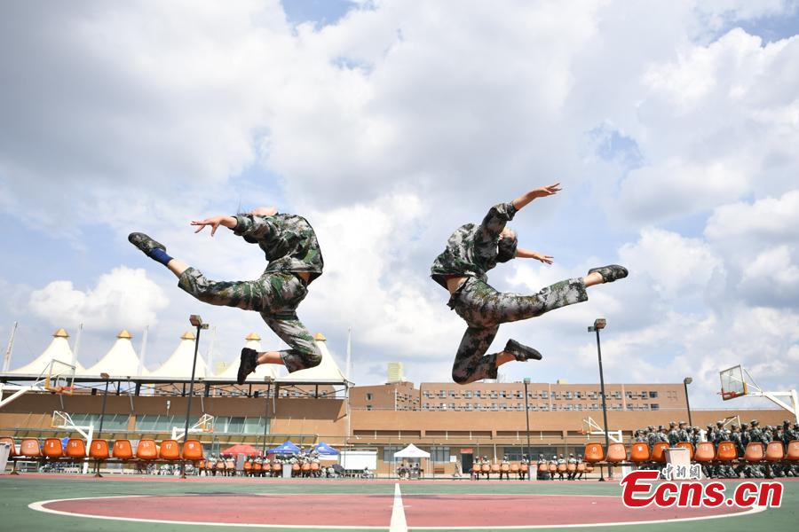 Freshman students from the Yunnan Arts University pose for photos during a compulsory military training in Kunming City, Southwest China’s Yunnan Province, Sept. 6, 2018. Military training, compulsory for freshmen in China\'s colleges, includes a diverse range of programs. (Photo: China News Service/Liu Ranyang)