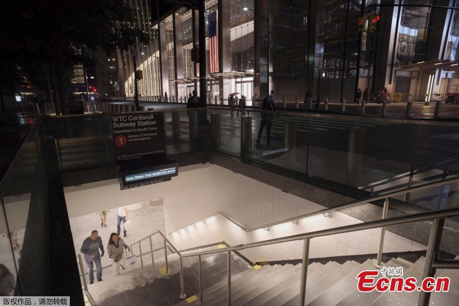 People walk up a flight of stairs in the World Trade Center complex from the newly-opened WTC Cortlandt subway station in New York, Sept. 8, 2018. The old Cortlandt Street station on the subway system\'s No. 1 line was buried under the rubble of the World Trade Center\'s twin towers on Sept. 11, 2001. Construction of the new station was delayed until the rebuilding of the surrounding towers was well under way. The new station cost $181 million and features a mosaic that uses words from the Declaration of Independence. (Photo/Agencies)