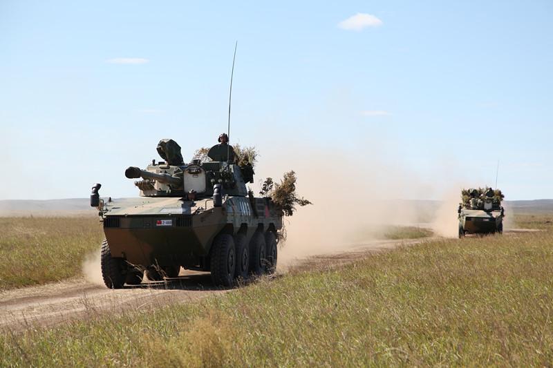 Chinese armed vehicles maneuver at the Tsugol training range in Russia\'s Trans-Baikal region. About 3200 Chinese troops attended the \