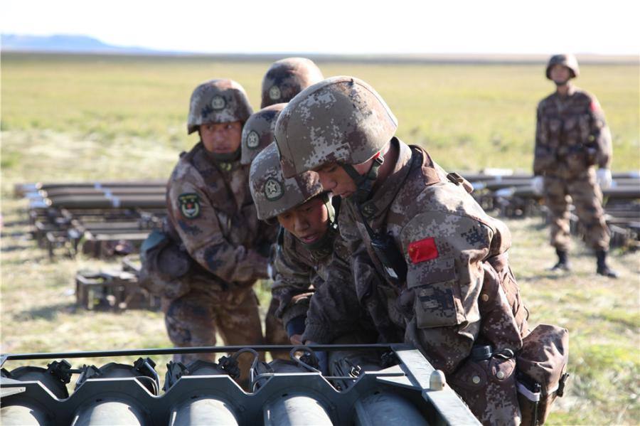 Chinese soldiers are loading rockets into the launcher at the Tsugol training range in Russia\'s Trans-Baikal region. (Photo by PAN Mengqi/chinadaily.com.cn)

About 3,200 troops, along with over 1,000 pieces of weaponry and 30 fixed-wing aircraft and helicopters from the People\'s Liberation Army (PLA)’s Northern Theater Command, are scheduled to conduct combat training together with the Russian troops from Tuesday to Thursday.

All Chinese troops participating in the drills were moved to the region by railway and highway before the end of August and immediately started preparing in the field.