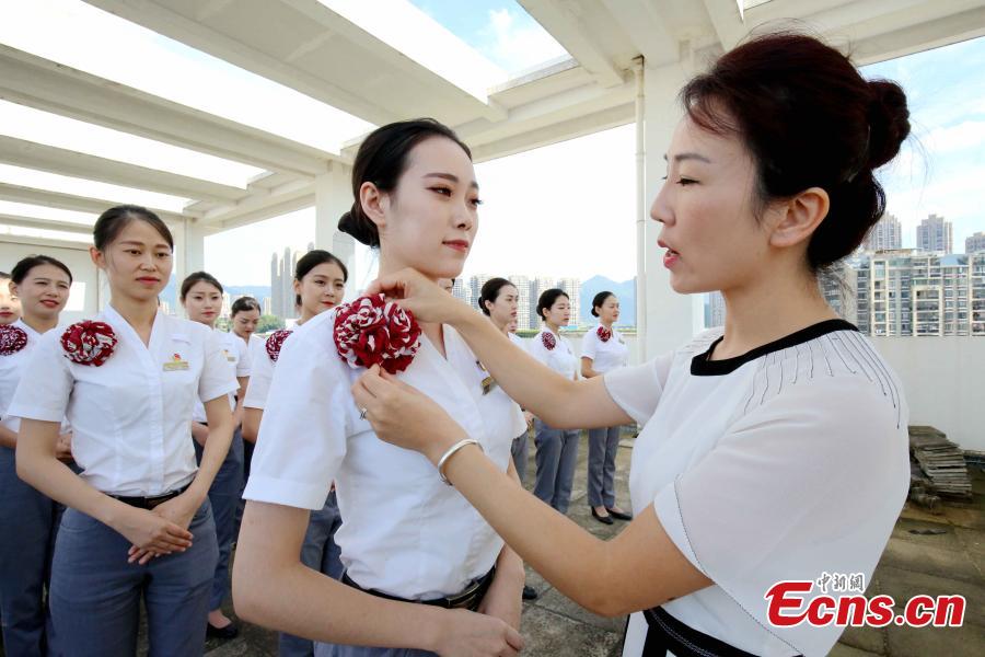 Train attendants receive extra training to prepare for the opening of the Guangzhou-Shenzhen-Hong Kong Express Rail Link in Fuzhou City, East China’s Fujian Province, Sept. 10, 2018. The XRL runs from a station in West Kowloon, heading north to the Shenzhen/Hong Kong Boundary, where it connects with the mainland section. Fuzhou and Xiamen, both cities in Fujian, will have direct high-speed services between Hong Kong’s West Kowloon station. The attendants undergoing training will serve on these trains. (Photo: China News Service/Li Yiming)