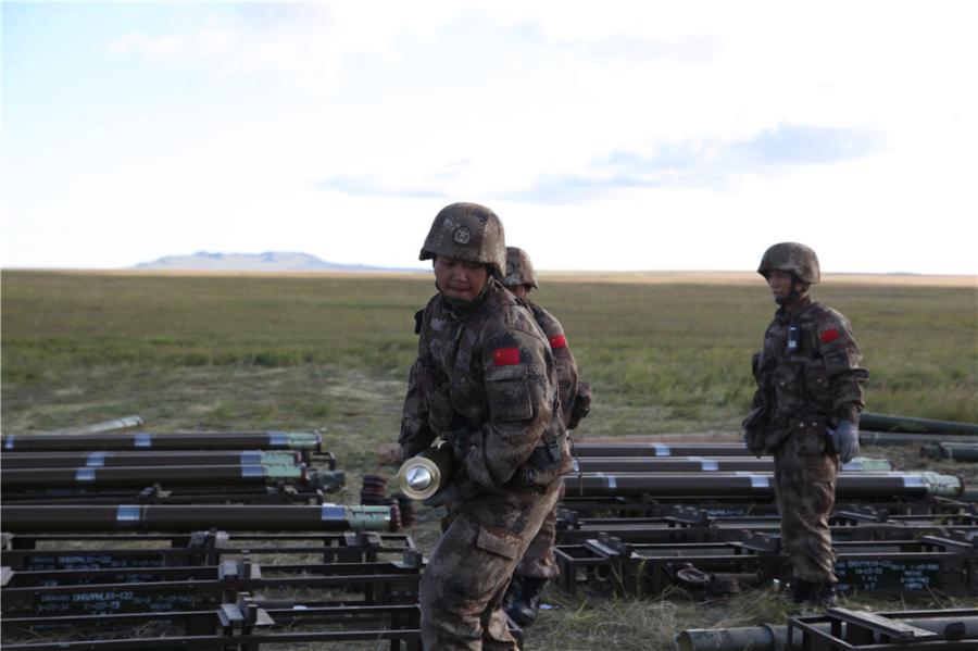 Chinese soldiers are loading rockets into the launcher at the Tsugol training range in Russia\'s Trans-Baikal region. (Photo by PAN Mengqi/chinadaily.com.cn)

Russian Defense Minister Sergei Shoigu said earlier that the drills involve nearly 300,000 Russian troops, about 36,000 military vehicles, more than 1,000 aircraft and around 80 ships.

Shoigu said the drills “will be unprecedented in terms of geographic scope and the strength of command and control centers and forces due to participate”.