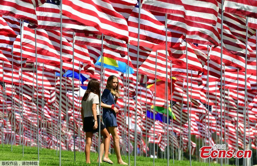 The Pepperdine University\'s annual display of flags honoring the victims of the 9/11 terrorist attacks, Sept. 10, 2018, in Malibu, California. Terrorists used hijacked planes to crash Sept. 11, 2001, into the World Trade Centers, the Pentagon and a field in Pennsylvania. The installation features a display of a total of 2,977 full-size flags—2,887 American flags for each American life lost and 90 various international flags representing the home countries of those from abroad who died in the 9/11 attacks. (Photo/Agencies)