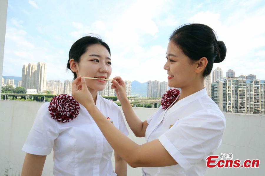 Train attendants receive extra training to prepare for the opening of the Guangzhou-Shenzhen-Hong Kong Express Rail Link in Fuzhou City, East China’s Fujian Province, Sept. 10, 2018. The XRL runs from a station in West Kowloon, heading north to the Shenzhen/Hong Kong Boundary, where it connects with the mainland section. Fuzhou and Xiamen, both cities in Fujian, will have direct high-speed services between Hong Kong’s West Kowloon station. The attendants undergoing training will serve on these trains. (Photo: China News Service/Li Yiming)