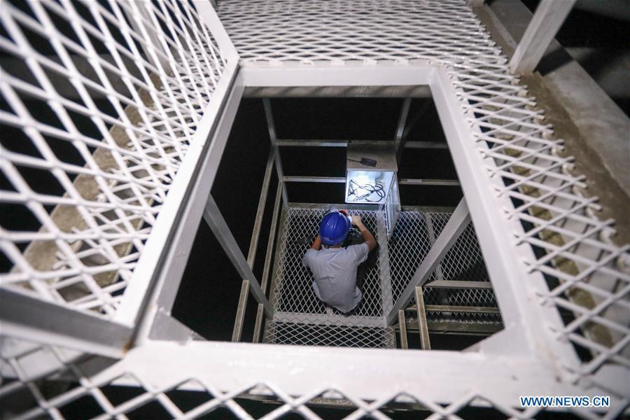 A staff member works at China\'s Five-hundred-meter Aperture Spherical Radio Telescope (FAST) in southwest China\'s Guizhou Province, Sept. 11, 2018. FAST has discovered 44 new pulsars so far. (Xinhua/Liu Xu)