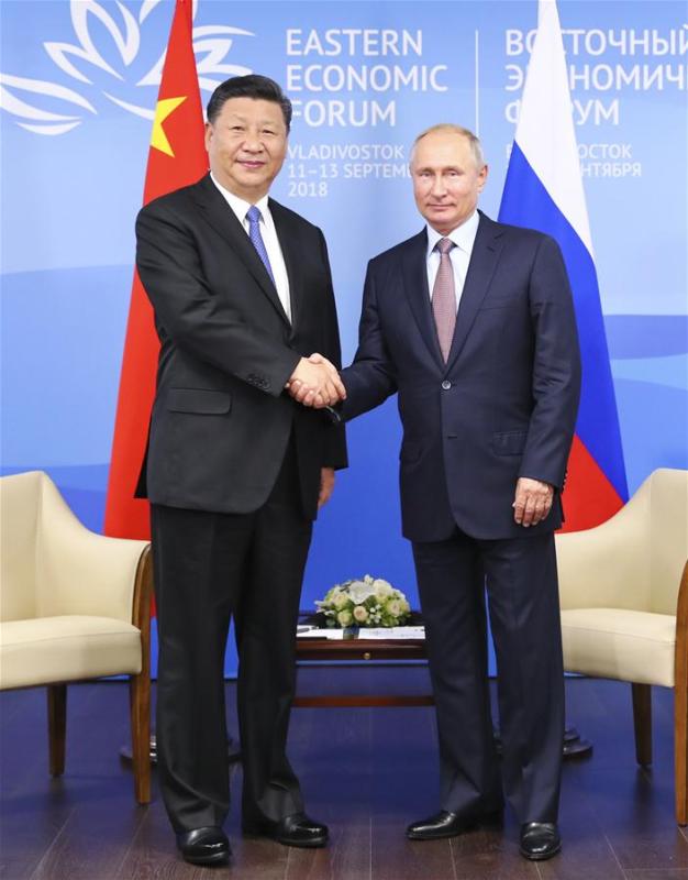 Chinese President Xi Jinping (L) holds talks with Russian President Vladimir Putin in Vladivostok, Russia, Sept. 11, 2018. (Xinhua/Huang Jingwen)