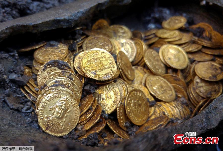 About 300 Roman-era gold coins were unearthed beneath what once was an Italian theater. The rare treasure was found by construction workers building an apartment complex at the previous site of the historic Cressoni Theater in northern Italy, which closed in the 1990s. What appears to be a soapstone vase or jar held the coins, believed to be from 474 B.C. (Photo/Agencies)