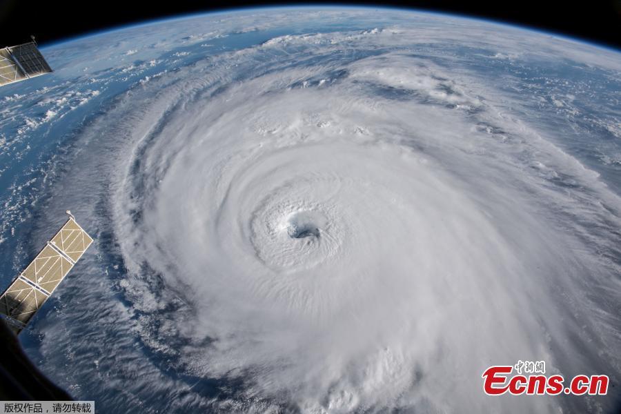 A view of Hurricane Florence is shown churning in the Atlantic Ocean in a west, north-westerly direction heading for the eastern coastline of the United States, taken by cameras outside the International Space Station, Sept. 12, 2018. Hurricane Florence, growing in size and intensity, crept closer to the U.S. East Coast on Wednesday as disaster mobilizations expanded south from the Carolinas into Georgia to counter the threat of fierce winds, deadly high seas and calamitous floods. (Photo/Agencies)