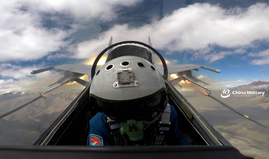 A pilot assigned to an aviation brigade of the air force under the PLA Western Theater Command pilots his J-11 fighter jet to conduct fire strike during the flight training exercise in the hinterland of the Kunlun Mountains in early September, 2018. (Photo/eng.chinamil.com.cn)