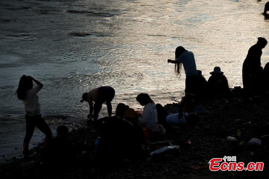 People celebrate the Karma Dunba (The Bathing Festival) in the Lhasa River in Lhasa City, Southwest China’s Tibet Autonomous Region, Sept. 15, 2018. Legend has it bathing during the period is beneficial to health. (Photo: China News Service/He Penglei)